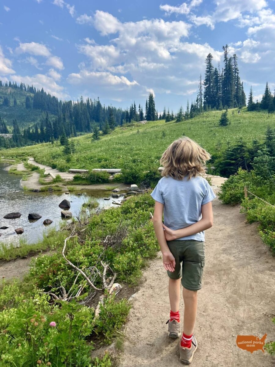 boy walking on the Tipsoo Lake Trail, Mt Rainier NP
